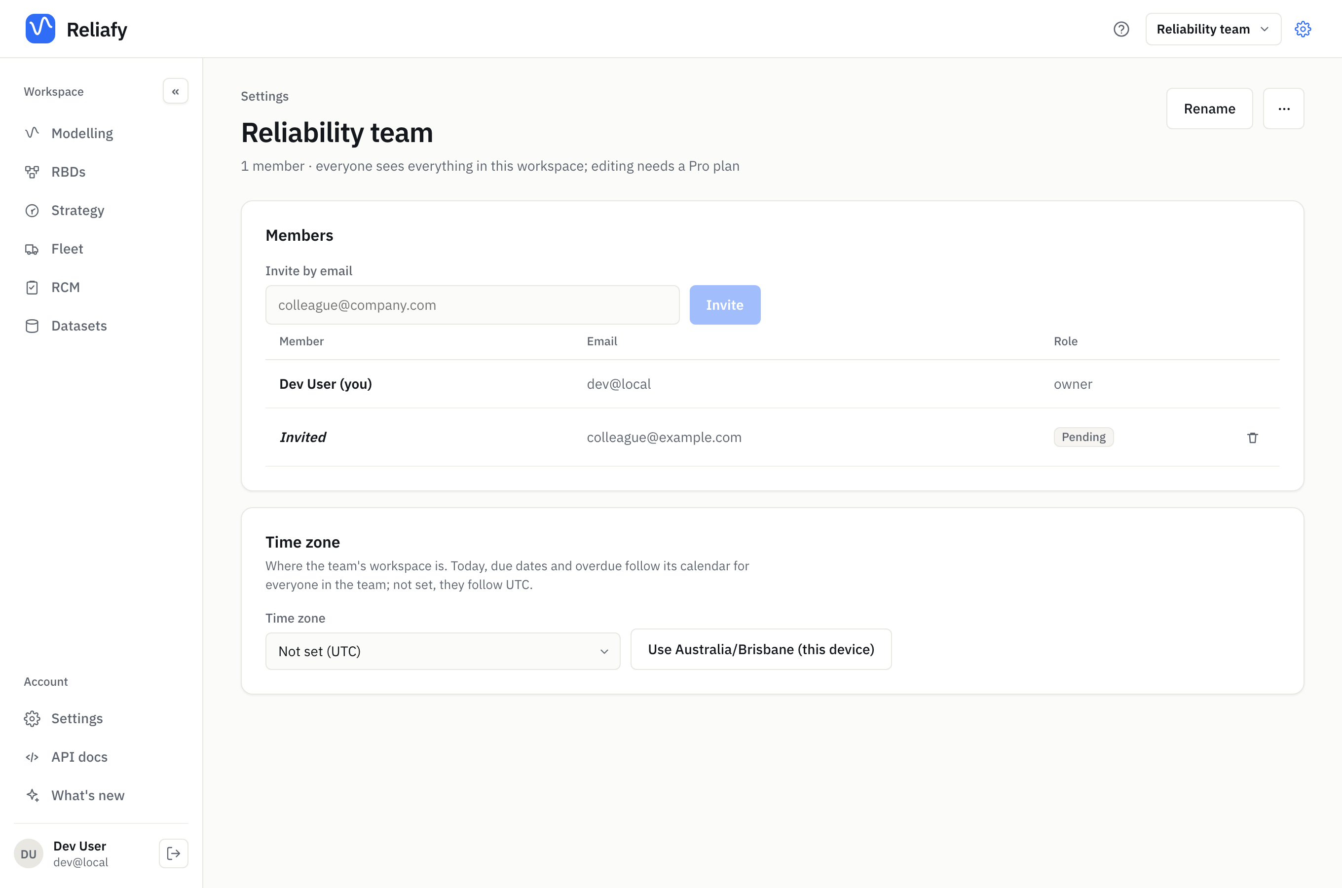 The team's settings: members, a pending invitation, and the time zone